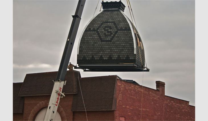 Because of its weight, the 23,000-pound cupola had to be raised and installed in three segments.
