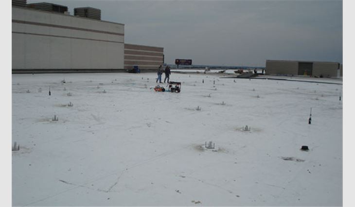 The facility's new white TPO roof system before solar array installation