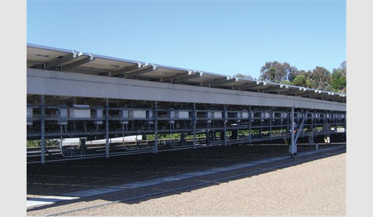 A PV system's associated hardware is housed beneath rooftop PV panels.