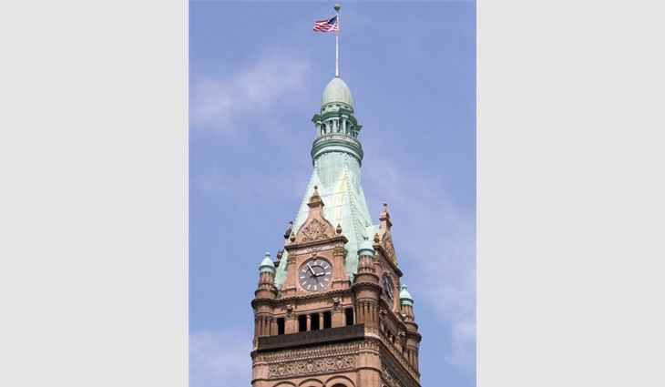 The south clock tower before F.J.A. Christiansen Roofing performed the copper roof replacement