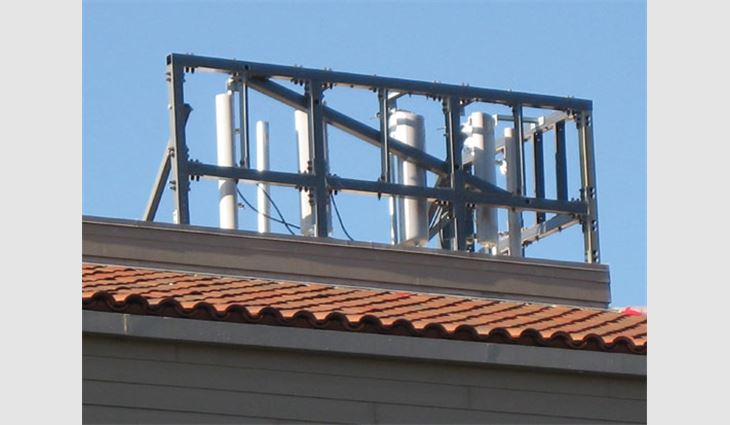 RF-transmitting antennas are hidden behind the faux wood siding and antenna structure, both of which are made of fiberglass.