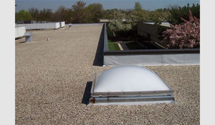 The existing built-up roof system before tear-off
