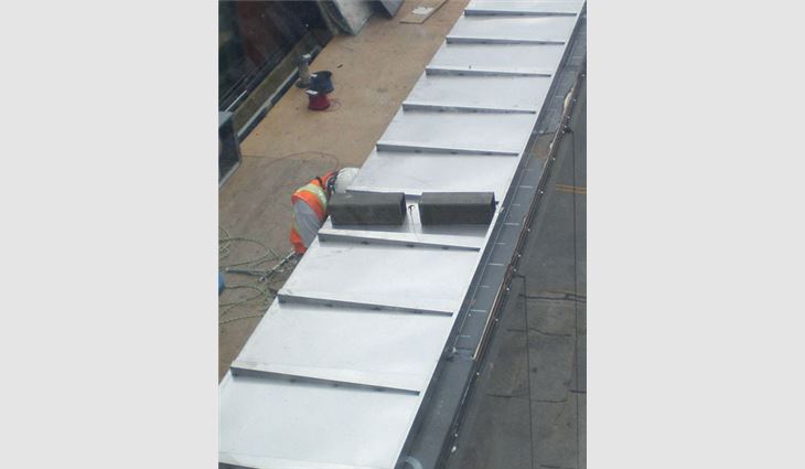 A stainless-steel parapet wall cover