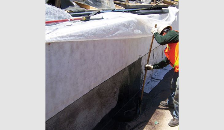 A Black Roofing crew member installs American Hydrotech Monolithic Membrane 6125&reg;