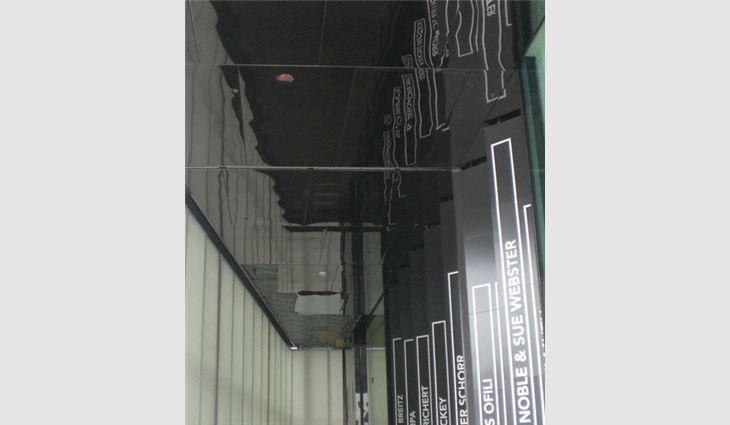 The finished museum entrance and mirrored stainless-steel soffit.