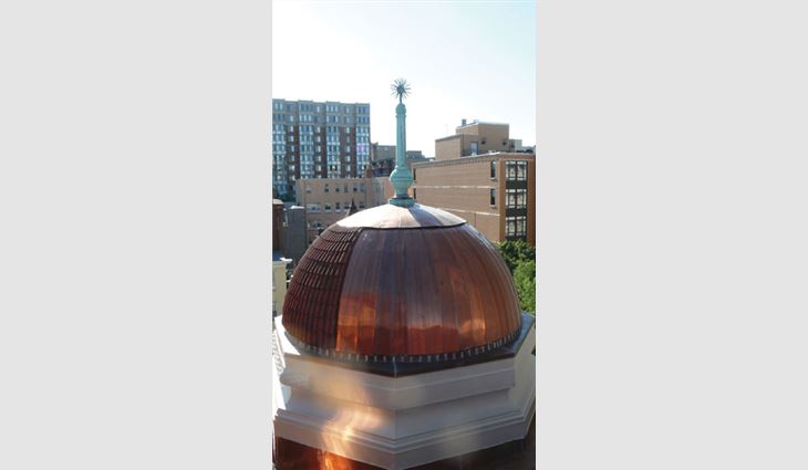 Because all the tile on the domes could not be salvaged, Wagner Roofing installed 20-ounce flat-seam copper on the rear of the domes where it cannot be seen from street level.