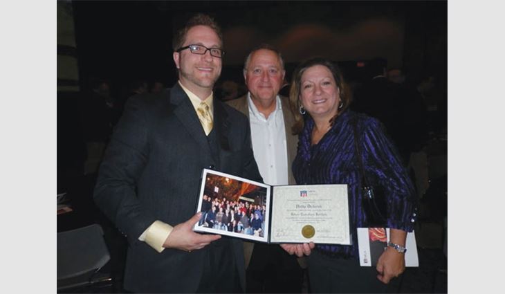Diederich (left) with his parents, Bruce and Flo, at NRCA's Future Executives Institute graduation.
