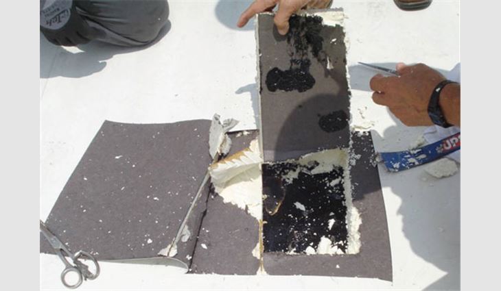 Photo 6: This asphalt has a glossy surface in some areas, indicating it cooled before insulation made contact.