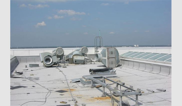These fans were on vibration isolators that did not provide uplift resistance. The fans blew away because the wind pressure exceeded the weight of the fans.