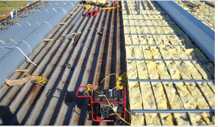 A 16-gauge engineered sub-girt system over 6-inch-thick batt insulation was applied to the existing roof system followed by 180-foot-long, 24-gauge aluminum-zinc alloy-coated roll-formed sheet-metal panels
