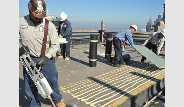 GeorgiaDensDeck&reg; Prime&trade; Roof Boards being attached with I.S.O. Twin Pack Insulation Adhesive. 

