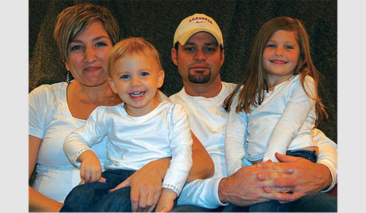 Hughes with his wife, Julie, and daughters, Alexis and Lacey