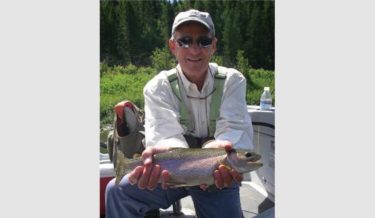 Braddy and his rainbow trout catch from Montana's Madison River
