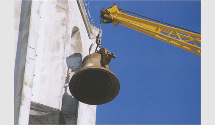 National Building Contractors Inc., Conyers, Ga., provided a crane and engineering support to help Monastery of the Holy Spirit, Conyers, remove a 1,600-pound bell for repair.