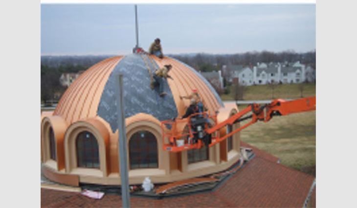 The domes were covered with Grace Construction Products' 30-mil-thick Ultra self-adhering underlayment followed by ATAS International's 0.040-inch-thick aluminum. standing-seam panels