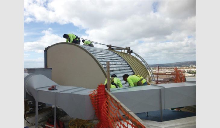 Workers repair one of five arched metal decks