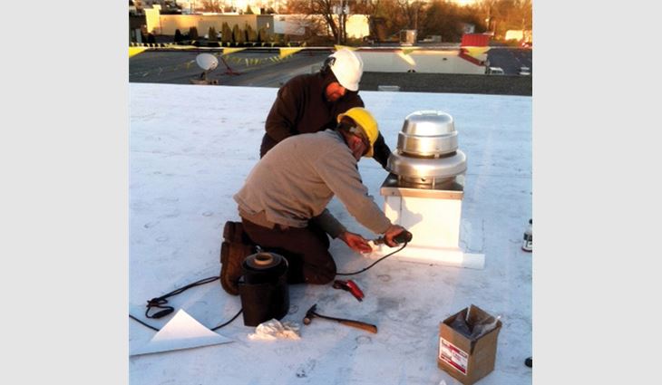 Watts works on a roofing project.