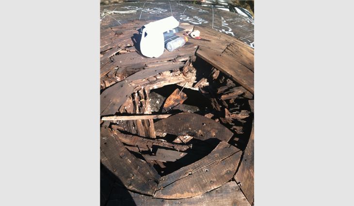Deteriorated rafters and deck material were repaired or replaced.