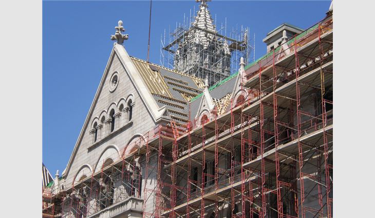 Although a built-in gutter and granite ledge provided space, full scaffolding was the only means of staging work.