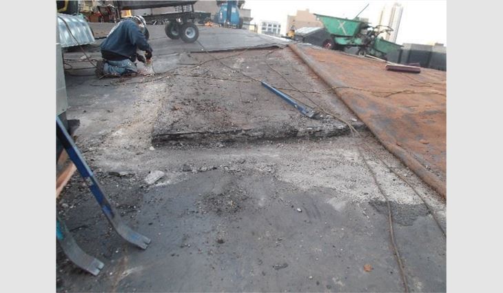 During tear-off, workers discovered multiple elements from other building structures that had been installed as parts of the concrete decks