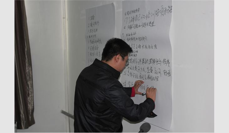 A student from Oriental Yuhong performs a classroom activity.