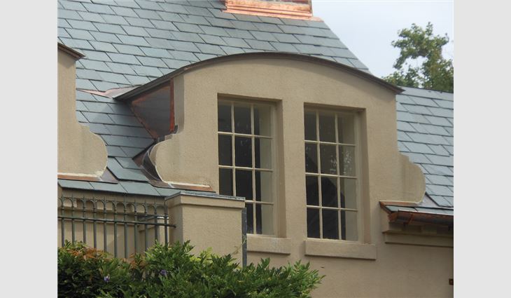 Metal work around dormers was modified to create weathertight conditions.