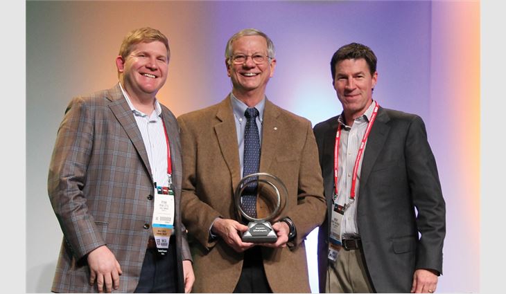 Former NRCA President Bruce McCrory presents KPost-Company, Dallas, with a Gold Circle Award.