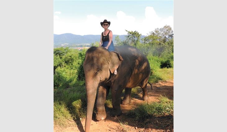 Ryan in Thailand riding Jenny the elephant