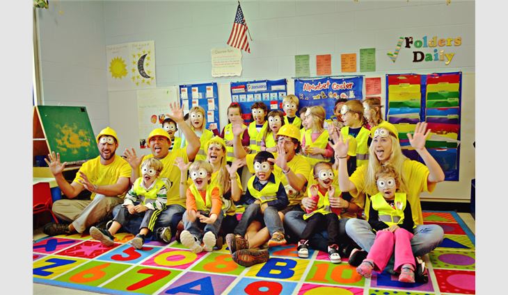 The children received construction vests and posed for photos.