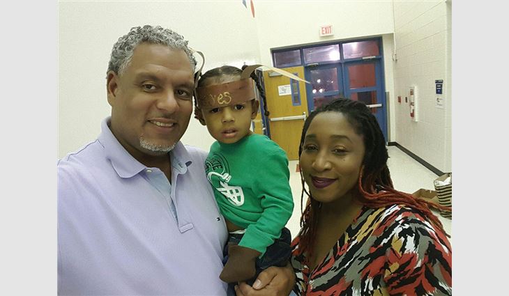 Purvis with his grandson, Arias, and his wife, Kiki