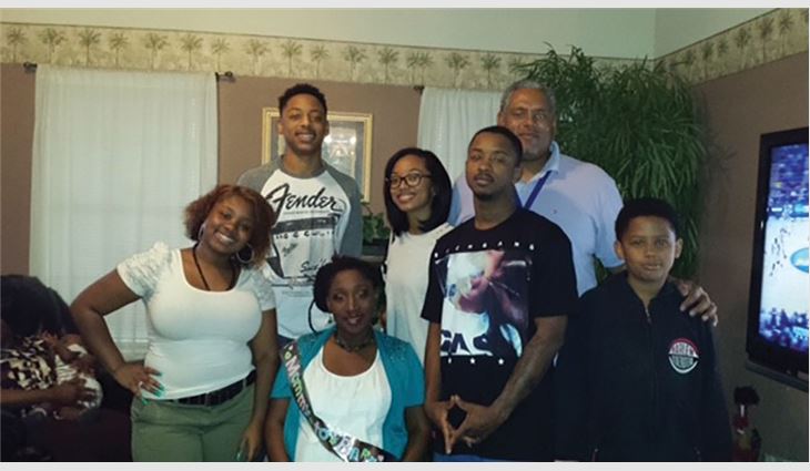 Purvis with his family. Pictured left to right: Stepdaughter, Erica; son Romeo; wife, Kiki; daughter Britney; stepson Jerric; Purvis; and stepson David 