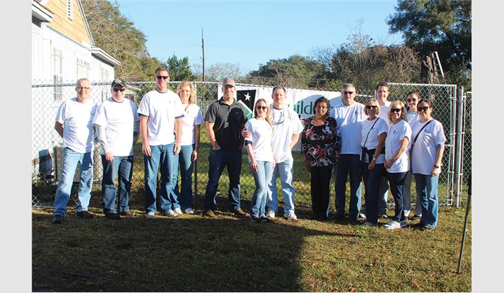 Volunteers helped rehabilitate three homes during Community Service Day.