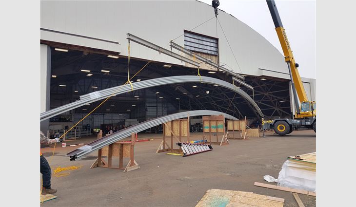 About 630 ZIP-RIB standing-seam panels ranging in lengths from 50 to 90 feet were fabricated and curved on-site