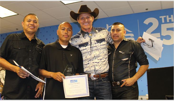 Alarcon and Charles Antis present Lobo Awards to Antis Roofing & Waterproofing employees