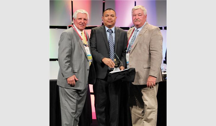 MVP Award winner Narciso Alarcon (middle) with Chairman of the Board Dennis Conway (left) and MVP Task Force Chairman Tim Rainey (right)
