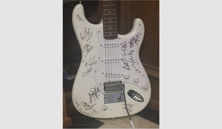 In appreciation of his efforts, the musicians gave Barr an autographed guitar.