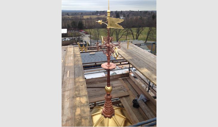 A newly replicated copper weathervane.