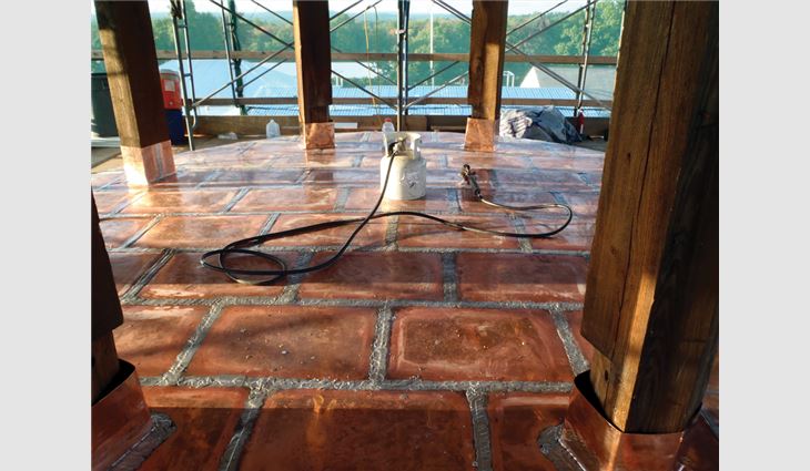New flat-seam copper on the bell tower floor.