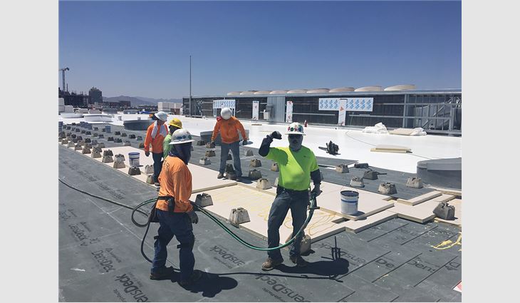 The Star Roofing crew worked swiftly to temporarily repair Burton Barr Central Library’s roof system and then later installed a new PVC membrane roof system on the buildings.