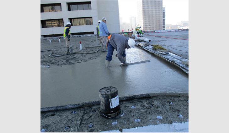 The annex's new roof system includes lightweight insulating concrete and adhered TPO membrane. 