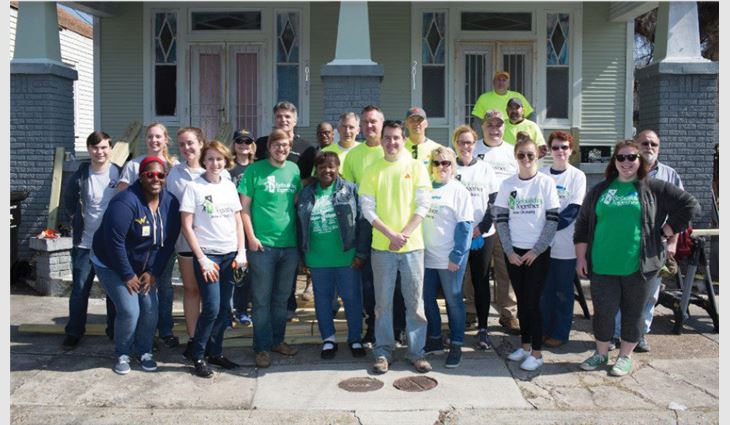 Volunteers help renovate three houses in New Orleans.