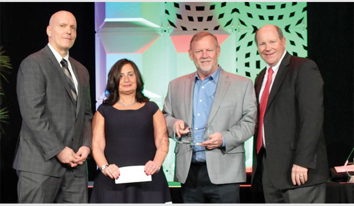 CNA/NRCA Community Involvement Award winners Linda and Michael O'Lyn of O'LYN Roofing, Norwood, Mass., with CNA Insurance representative Rick Childs (left) and NRCA CEO Reid Ribble (right)