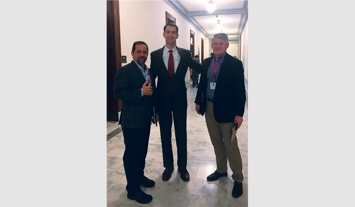 Joel Johnson (left), president of P.I. Roofing, North Little Rock, Ark., and David Workman (right), president and CEO of RoofConnect, Sheridan, Ark., meet with Sen. Tom Cotton (R-Ark.).
