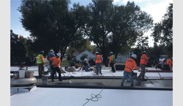 Employees at Front Range Roofing Systems LLC, Greeley, Colo., donated their labor to install a new TPO membrane roof system on a school.