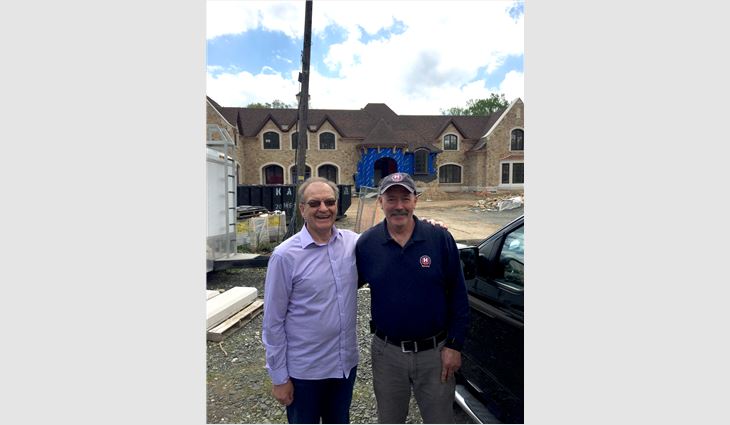 Stuart Matthews, founder of Northern Roof Tiles U.S. Inc., Wilmington, Del., and Kevin Lyons, steep-slope president of Hayden Building Maintenance Corp., West Nyack, N.Y.