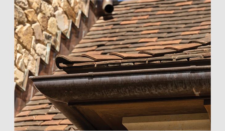 Hayden Building Maintenance workers custom-fabricated all metal for the roof system that included cold-rolled standing- and flat-seam copper as well as copper gutters, 
downspouts, finials and flashings.
