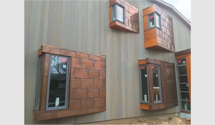 Twenty-ounce locked-seam copper panels were installed on four bay windows. 