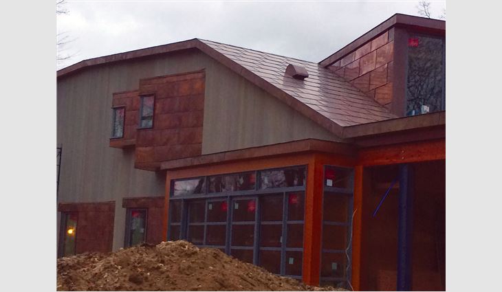 TRM Enterprises craftsmen also custom-created and installed copper built-in gutters, downspouts and roof edge fascia trim elements.