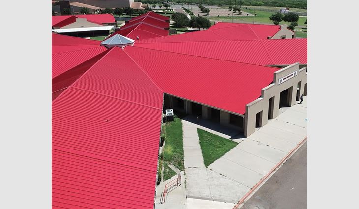 Rio Roofing workers fastened 141,800 lineal feet of McElroy Metal symmetrical standing-seam Galvalume® panels in PVDF Brite Red.  