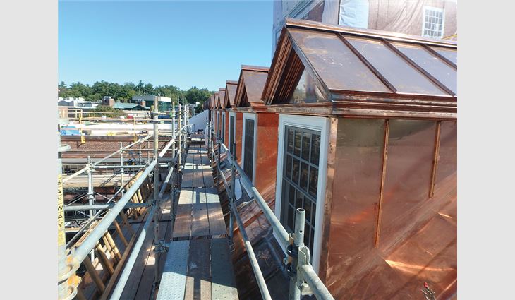 From the tower’s dormers, craftsmen removed and replaced all the standing-seam copper roofing, flashings and trim; removed and replaced copper cladding; and installed new copper trim and casing and new copper sills at dormer windows.